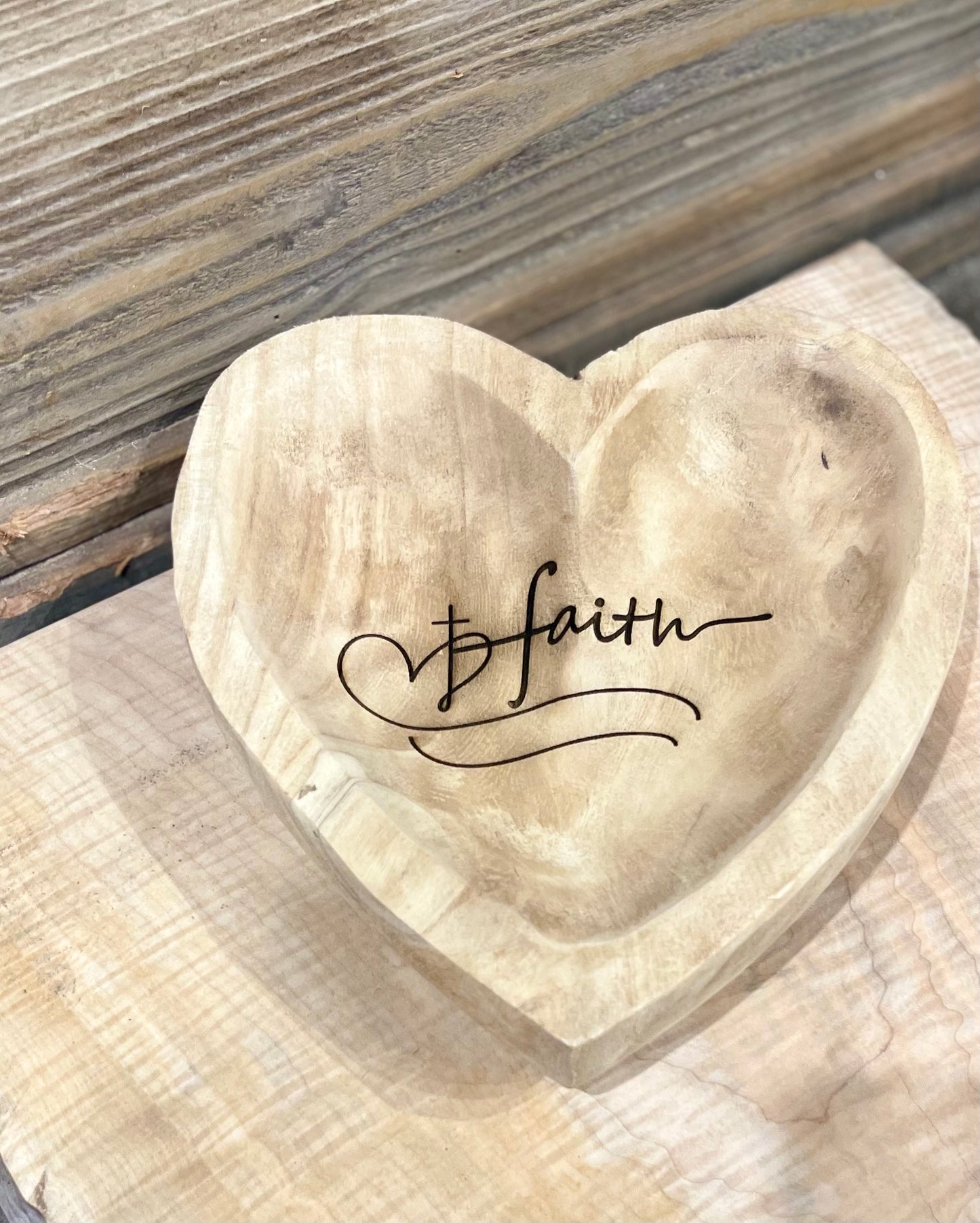 Laser engraved heart dough bowl with the word faith and a cross overlaying a heart