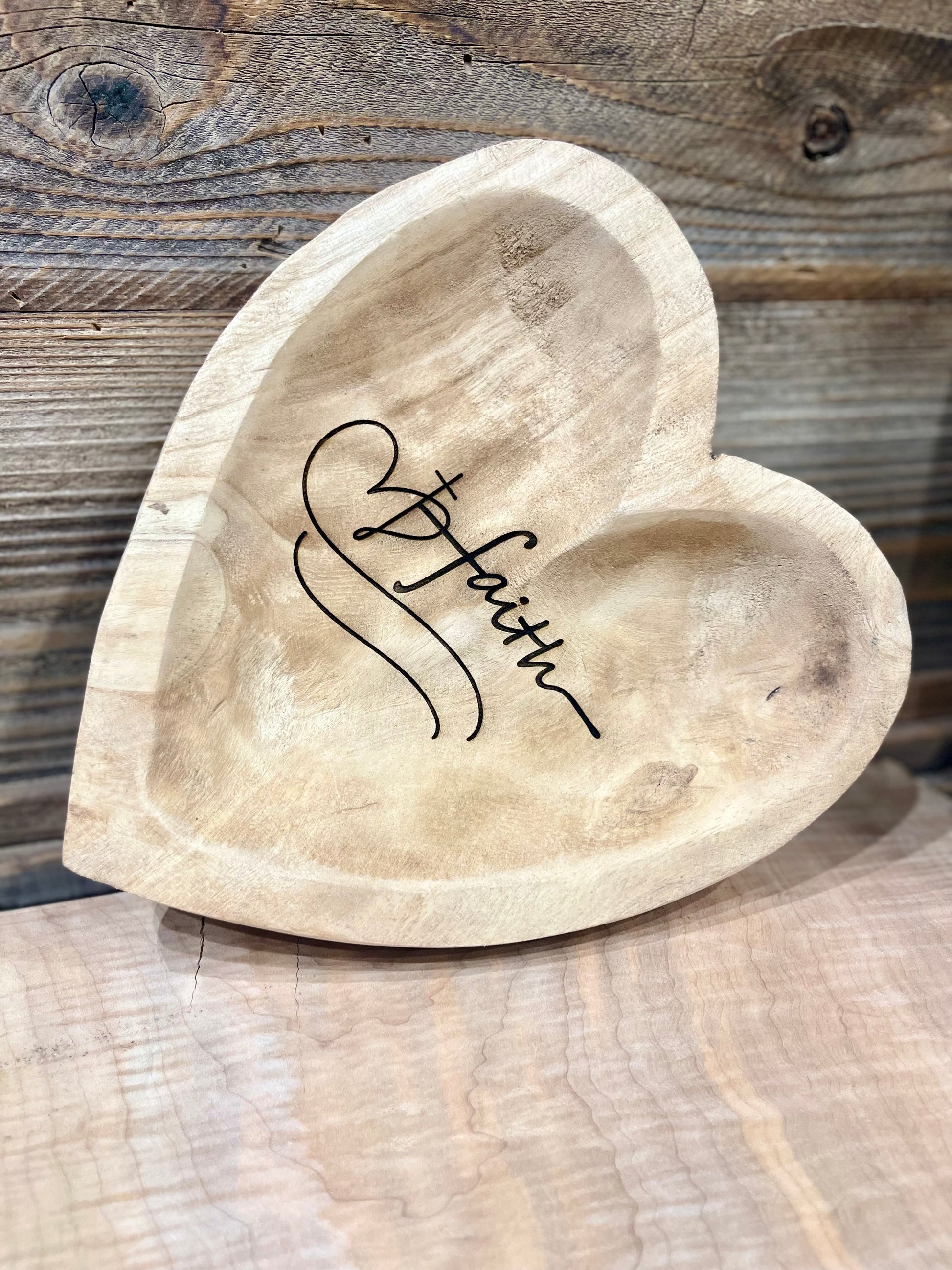 laser engraved heart dough bowl with the word faith and a cross overlaying a heart